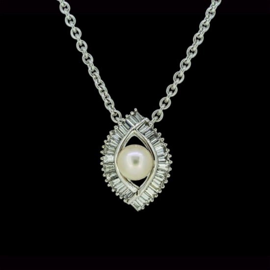 Gold and diamond locket with pearl