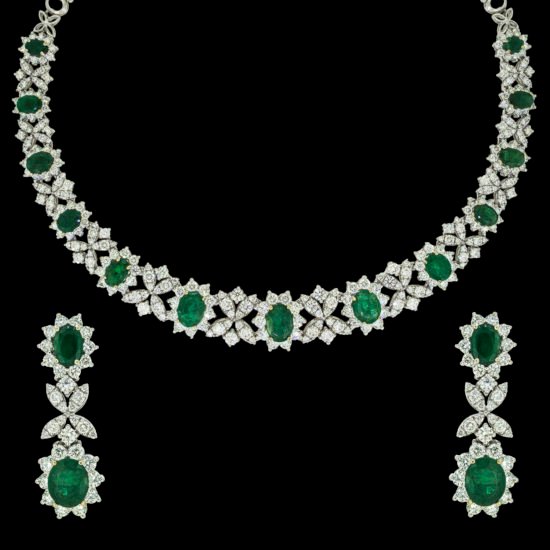 Gold necklace set with diamonds and lush green emeralds