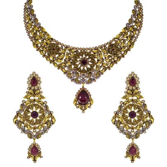 Traditional handcrafted gold necklace set with red gemstones