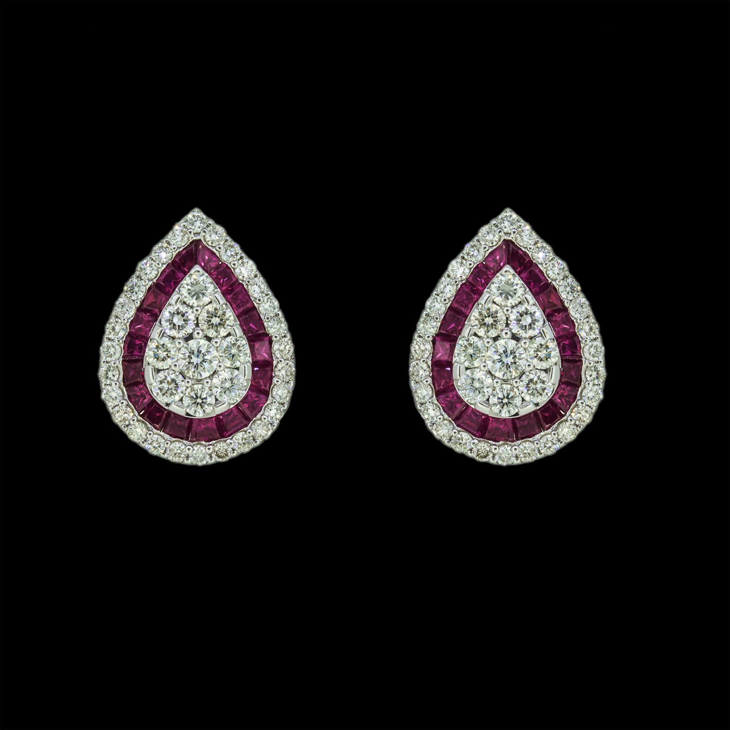 Gold earrings studded with diamonds and rubies